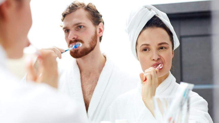 How do I brush my teeth properly?